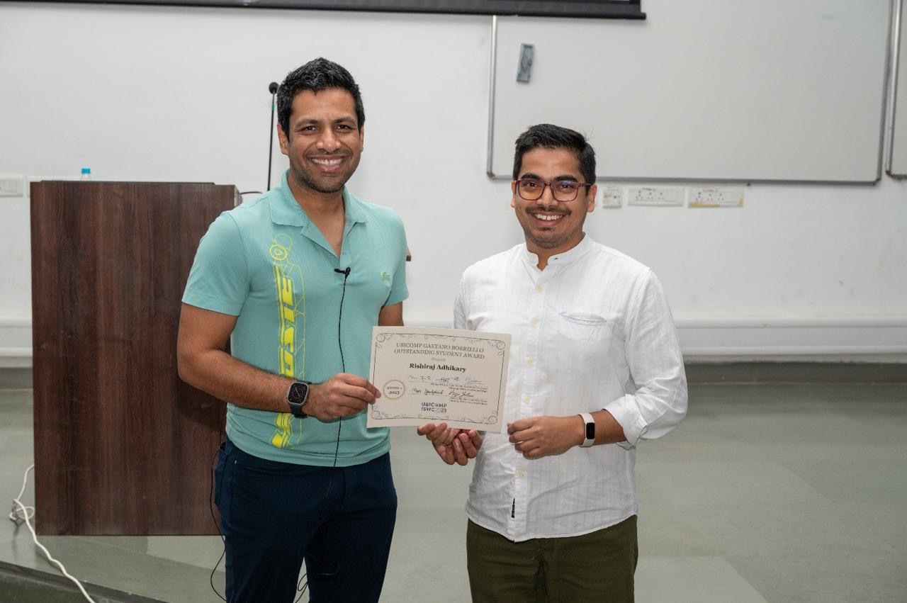 Rishiraj receiving UbiComp certificate